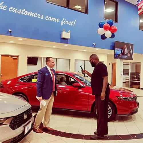  General Manager, Dan Loggins being filmed in our beautiful showroom for a Rt 128 Honda Commerical