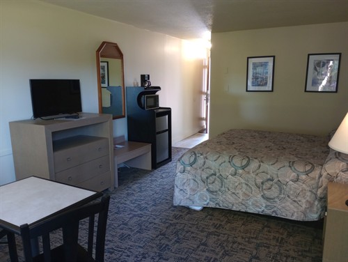 King bed room with courtyard access