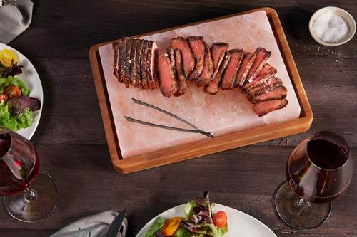 Wagyu New York Strip Steak served on a Himalayan Salt Plank