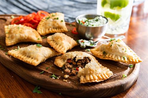 Brazilian Empanadas: Flaky pastry, seasoned Picanha, onions, chimichurri aioli.
