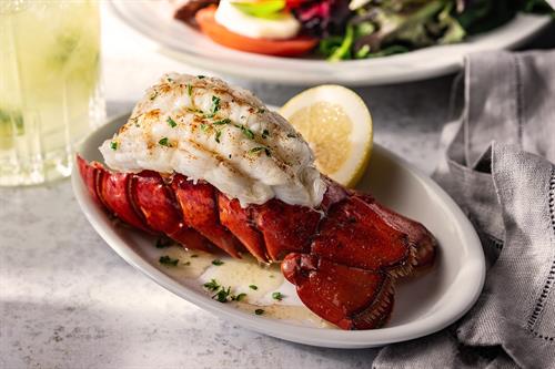 Butter-Bathed Lobster Tail: Available as an enhancement to the Full Churrasco Experience, succulent lobster tail bathed in melted butter, delivering unmatched tenderness and a decadent, sweet finish.