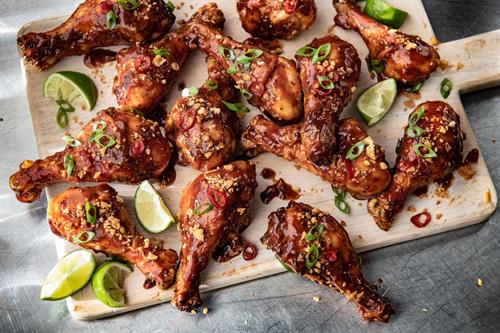 Saucy Legs: Fire-roasted chicken, hot Brazilian BBQ, Pão de Queijo crispies, dedo de moça peppers