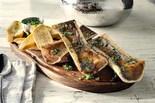 Roasted Bone Marrow: Available as an enhancement to the Full Churrasco Experience, rich bone marrow served with crispy toast and bold chimichurri for a savory, flavorful experience.
