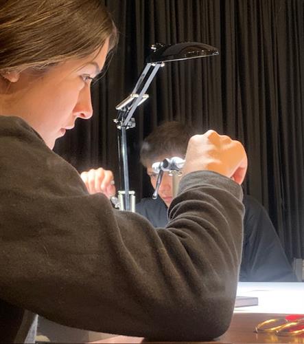 Local kid learning to tie flies at a Foundation fly tying clinic