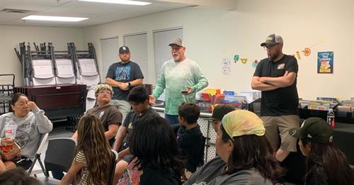 Board membrs and volunteers teach kids on the water and in the classroom