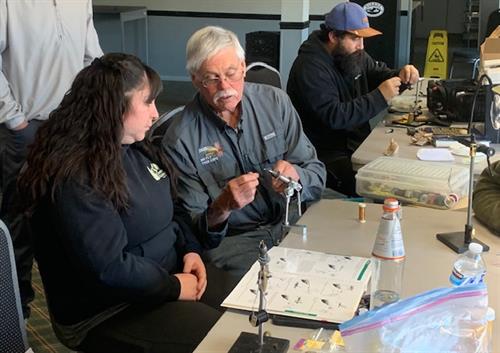 Local Bishop legend Mark McKenzie helping at a fly tying clinic