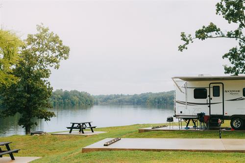 Wake up to sunsets at a lakefront RV site with full hookup, concrete pad, 30/50 amp, picnic table and fire pit, and free wifi. Wake up to sunsets at a lakefront RV site with full hookup, concrete pad, 30/50 amp, picnic table and fire pit, and free wifi.