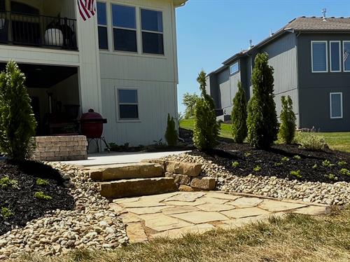 Natural stone steps with flagstone landing