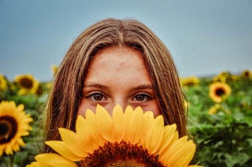 Gallery Image Sunflowers_-_girl_behind_flower_(camille.gubbins).JPG
