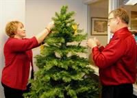 Donita Wolf, director and Larry Schumacher, chaplain placing memorial angels on the "Tree of Life" Donita Wolf, director and Larry Schumacher, chaplain placing memorial angels on the "Tree of Life"