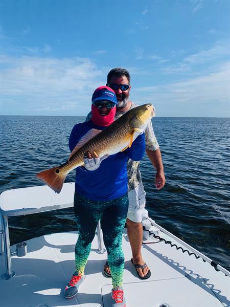 Capt Jaime and his wife with a nice South Texas Redfish Capt Jaime and his wife with a nice South Texas Redfish
