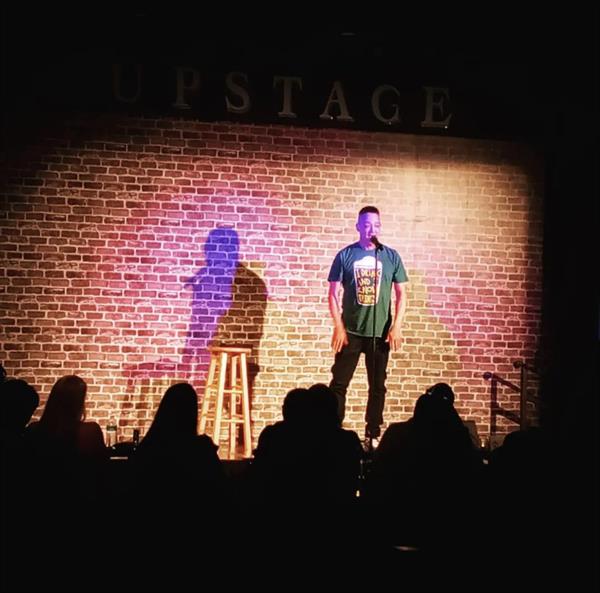 Christopher “Kid” Reid on stage at a comedy club in San Antonio.