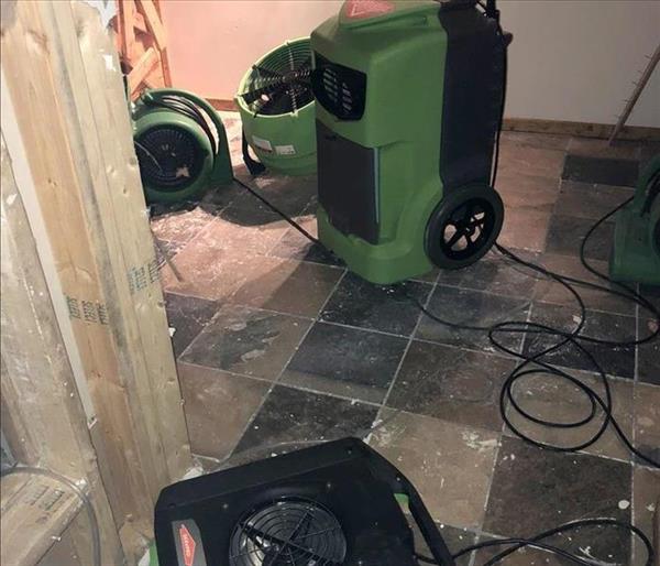 This is a picture of a professional dehumidifier used to take the moisture out of the air after water loss.  SERVPRO can equip your property with the right equipment every step of your restoration clean up.