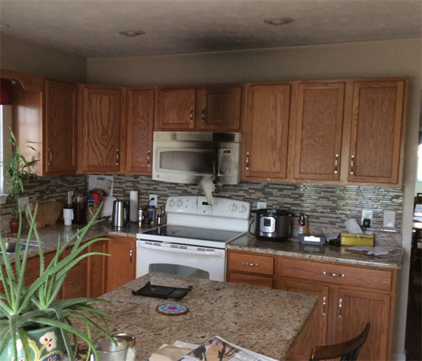 This was the aftermath of a kitchen fire in Harrisonburg when we arrived on the scene. There were significant smoke and soot damage on cabinets and ceiling. The owner could not believe how quickly and completely we were able to clean the soot from the cabinets and ceiling. We make disasters "Like it never even happened."