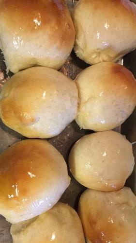 Homemade yeast rolls with honey butter glaze