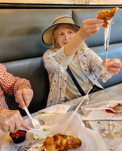 Guest enjoying a fresh mozzarella pull on the Ybor City Food Tour 