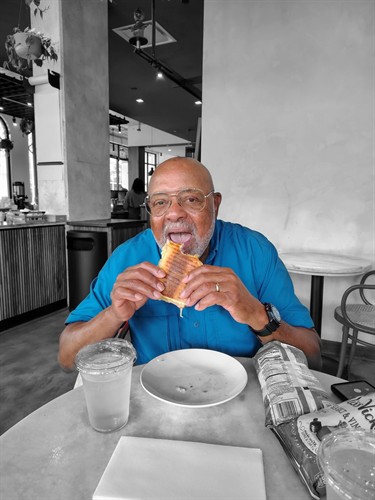 Guest loving his Cuban sandwich tasting on the Ybor City Food Tour. 