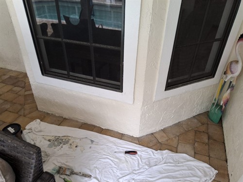 Damaged area cleaned out and exterior wall rebuilt, patched, and refinished for a clean restored look.