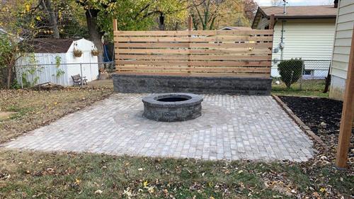 Paver patio with built in firepit and privacy wall