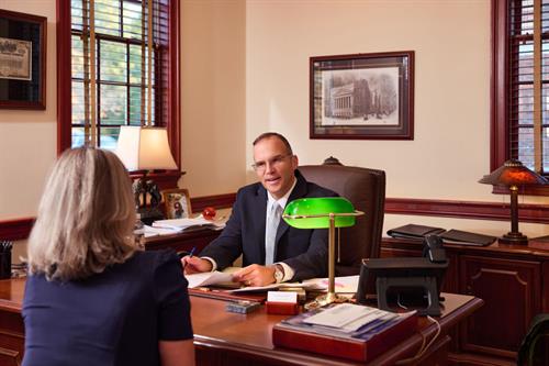 An advisor (Todd) meeting with a client