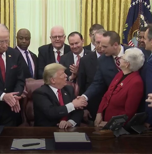 John Koufos in the Oval Office during a bill signing