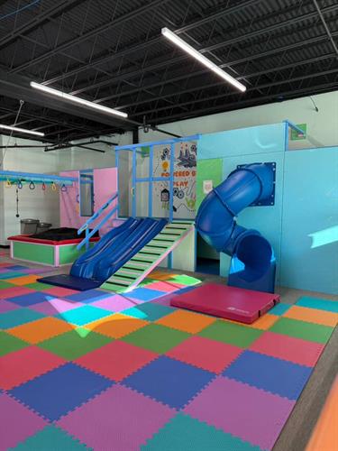 Part of our main play structure complete with crash pads, secret tunnels, and interactive sensory lights.