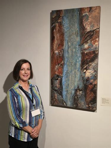 Robin with Turquoise Rock painting at Fitton Center 