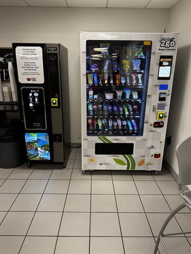 Coffee machine and Combo Snack and Drink Machine at a car dealership.