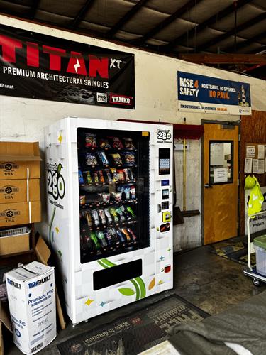 Combo Snack and Drink Machine in a warehouse.