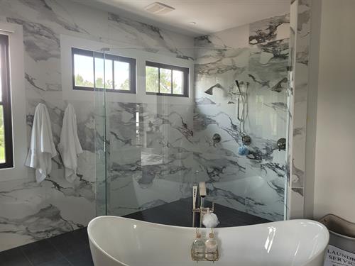 Fantastic, large marble tiles are the perfect luxurious finish for this shower experience.