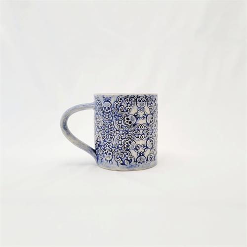 mug with embossed skulls and scrolls vintage blue