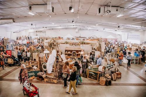 Indoor shopping with vendors showcasing goods in store-like displays!