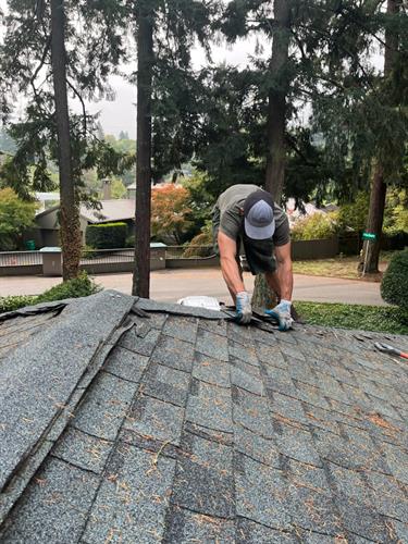 Crew working on roof installation by French Roofing