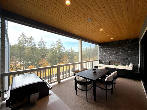 Nano 70 no-see-ums screens surround this covered deck, helping keep tiny insects away from dining and lounge areas.