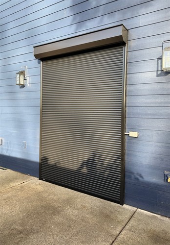 A fitted security roll shutter closes over this exterior doorway in Tualatin.