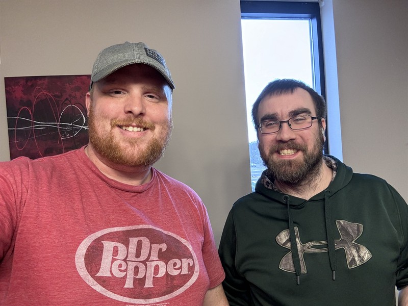 Adam and Brian are at a shared workspace before the office