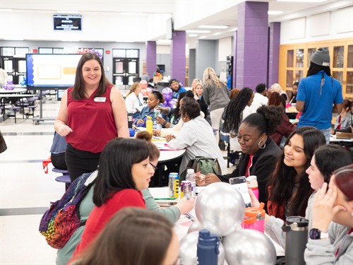 Krissy Metzler speaking with group of educators at an interactive workshop.