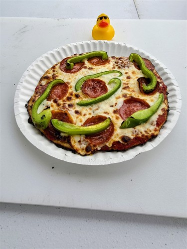 Duck Hutson with served pizza