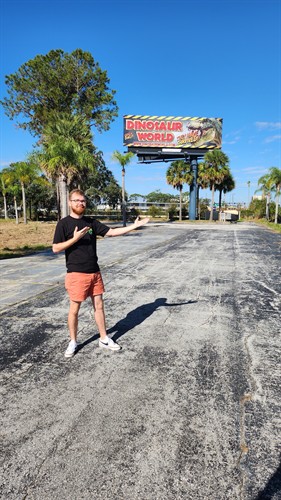 Dallas with a billboard he designed