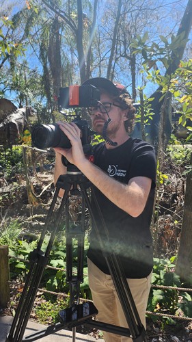 Dallas operating a video camera