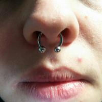 Nose piercing by Justin Whitehouse