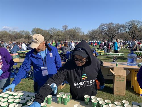All smiles and bright faces while volunteering at the 2022 Credit Union Cherry Blossom 10 Mile event! 