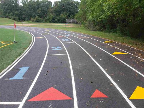Running track stenciled and striped.