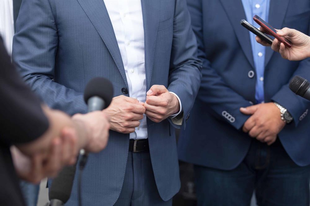 Discreet bodyguard presence during public media interaction | Global Risk Solutions, Inc. Discreet bodyguard presence during public media interaction | Global Risk Solutions, Inc.