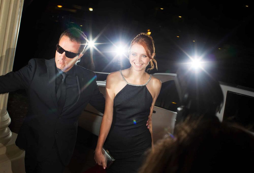 Celebrity bodyguard escorts client through red carpet arrival | Global Risk Solutions, Inc. Celebrity bodyguard escorts client through red carpet arrival | Global Risk Solutions, Inc.