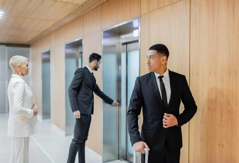 Executive protection team escorting client through secure corporate facility | Global Risk Solutions, Inc. Executive protection team escorting client through secure corporate facility | Global Risk Solutions, Inc.