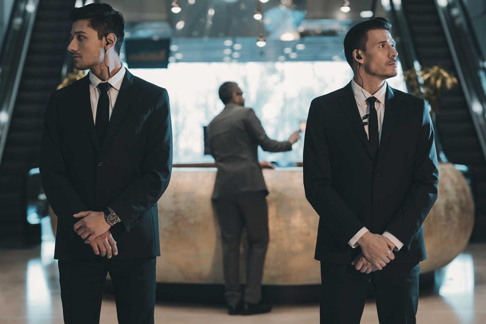 Professional hotel security team ensuring guest safety in luxury lobby | Global Risk Solutions, Inc. Professional hotel security team ensuring guest safety in luxury lobby | Global Risk Solutions, Inc.