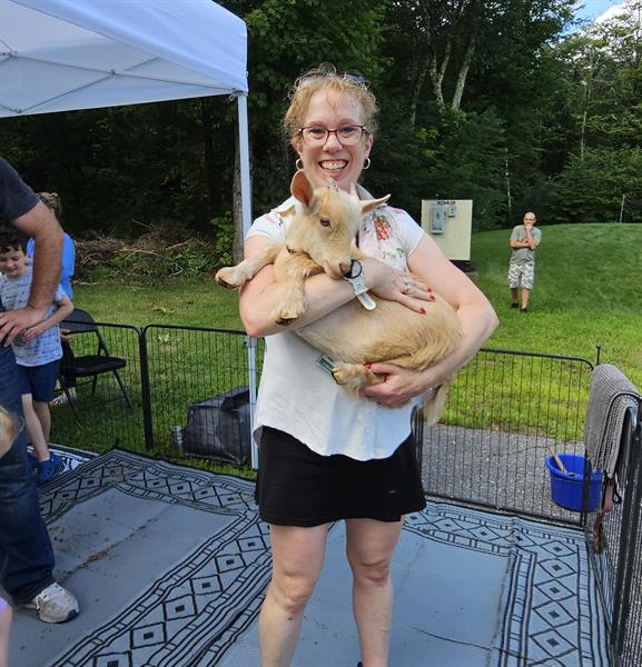 Library Director Melissa Mannon at Imagination Festival petting zoo