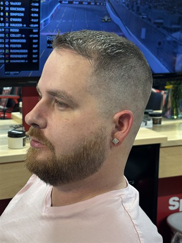This clean skin fade and sharp beard detail from Adelina show the craft you'll find at every visit to Sport Clips Haircuts in Bradenton, Manatee County, in Centre Point Commons between Chipotle and First Watch. Our stylists deliver fades, tapers, and men's grooming built around the MVP Experience, with walk-in haircuts always welcome alongside online check-in. Se habla español.