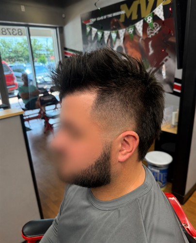 This customized textured faux hawk with a clean beard lineup is the kind of precision haircut Sport Clips Haircuts of Lakewood Ranch delivers every day, serving the Lakewood Ranch community at Center Point at Waterside, near Owen's Fish Camp and Ruth's Chris on the SE corner of University Parkway and Lakewood Ranch Boulevard. Walk in or use online check-in. It's a Game Changer.